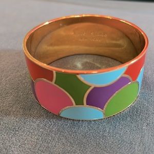 Kate Spade multi colored dot outlined in gold wide bangle. Great with any outfit